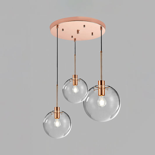 Rose Gold Round Cluster Pendant Light Minimalist 3-Bulb Clear Glass Ceiling Hang Fixture Clearhalo 'Ceiling Lights' 'Glass shade' 'Glass' 'Modern Pendants' 'Modern' 'Pendant Lights' 'Pendants' Lighting' 520179