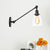 Black/Bronze/Brass 1 Light Wall Light Fixture Industrial Style Clear Glass Tapered Sconce with Arm, 8"/12" L Black Clearhalo 'Art deco wall lights' 'Cast Iron' 'Glass' 'Industrial wall lights' 'Industrial' 'Middle century wall lights' 'Modern' 'Rustic wall lights' 'Tiffany' 'Traditional wall lights' 'Wall Lamps & Sconces' 'Wall Lights' Lighting' 520235