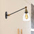 Black/Bronze/Brass 1 Light Wall Light Fixture Industrial Style Clear Glass Tapered Sconce with Arm, 8"/12" L Brass Clearhalo 'Art deco wall lights' 'Cast Iron' 'Glass' 'Industrial wall lights' 'Industrial' 'Middle century wall lights' 'Modern' 'Rustic wall lights' 'Tiffany' 'Traditional wall lights' 'Wall Lamps & Sconces' 'Wall Lights' Lighting' 520240
