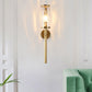 Modernist Cylinder Sconce Light Fixture Clear Water Glass 1 Light Corner Wall Lamp in Brass with Pencil Arm Clearhalo 'Cast Iron' 'Glass' 'Industrial' 'Modern wall lights' 'Modern' 'Tiffany' 'Traditional wall lights' 'Wall Lamps & Sconces' 'Wall Lights' Lighting' 520682