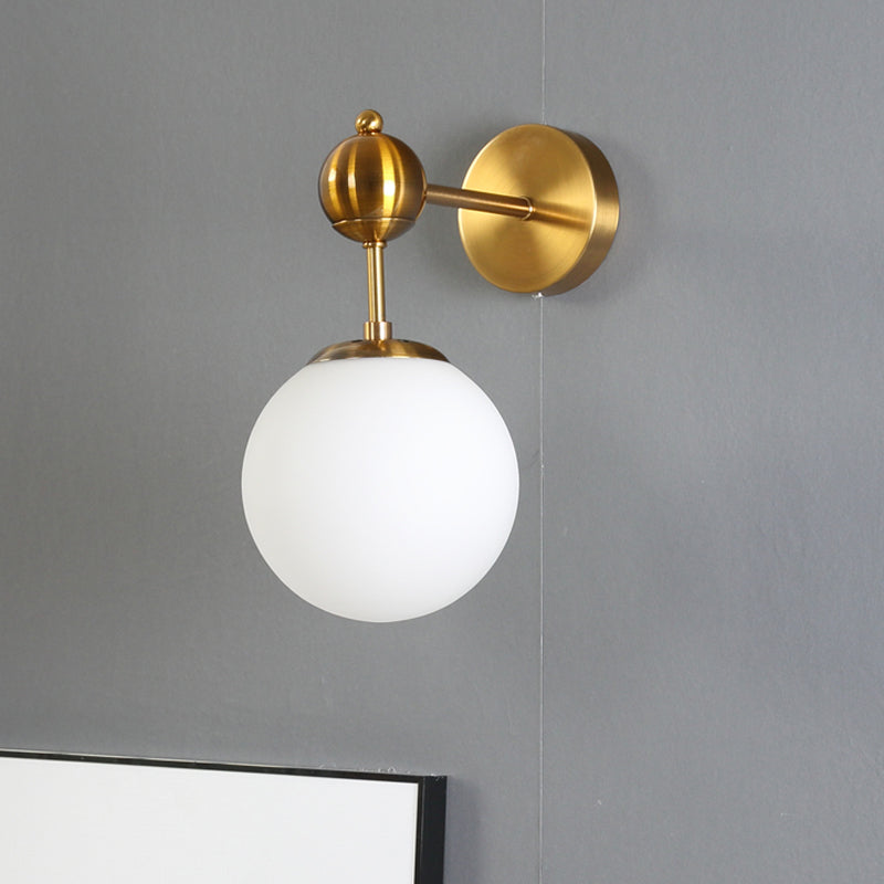 White Glass Global Wall Light Fixture Post Modern 1-Bulb Sconce Lamp in Brass with Adjustable Node Brass Clearhalo 'Cast Iron' 'Glass' 'Industrial' 'Modern wall lights' 'Modern' 'Tiffany' 'Traditional wall lights' 'Wall Lamps & Sconces' 'Wall Lights' Lighting' 520736