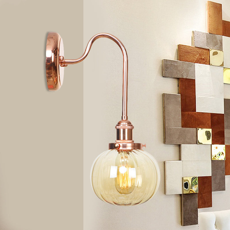 Vintage Globe Wall Lighting 1 Light Clear/Amber Glass Sconce in Copper with Curved Arm Clearhalo 'Art deco wall lights' 'Cast Iron' 'Glass' 'Industrial wall lights' 'Industrial' 'Middle century wall lights' 'Modern' 'Rustic wall lights' 'Tiffany' 'Traditional wall lights' 'Wall Lamps & Sconces' 'Wall Lights' Lighting' 521304
