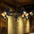 5 Lights Pendant Chandelier Art Deco Camera Metallic Hanging Ceiling Lamp in Black with Ring Design Black Clearhalo 'Cast Iron' 'Ceiling Lights' 'Chandeliers' 'Industrial Chandeliers' 'Industrial' 'Metal' 'Middle Century Chandeliers' 'Rustic Chandeliers' 'Tiffany' Lighting' 537519