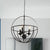 Black Circle Hanging Lamp with Cage Shade Antique Metallic 3-Light Restaurant Chandelier Light Fixture Black Clearhalo 'Cast Iron' 'Ceiling Lights' 'Chandeliers' 'Industrial Chandeliers' 'Industrial' 'Metal' 'Middle Century Chandeliers' 'Rustic Chandeliers' 'Tiffany' Lighting' 600545