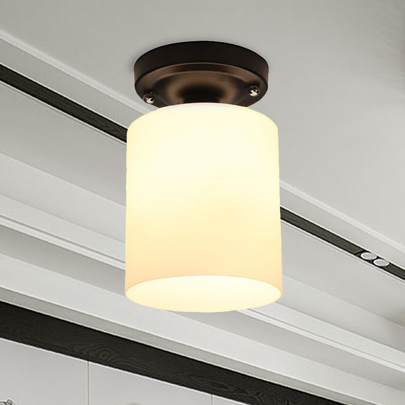 Black One Light Ceiling Mount Industrial Milky Glass Cylinder Semi Flush Light for Corridor Clearhalo 'Ceiling Lights' 'Close To Ceiling Lights' 'Close to ceiling' 'Glass shade' 'Glass' 'Island Lights' 'Semi-flushmount' Lighting' 605819