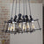 Black Cluster Pendant Light with Cage Shade Retro Metallic 6 Lights Farmhouse Ceiling Fixture Black Clearhalo 'Art Deco Pendants' 'Black' 'Cast Iron' 'Ceiling Lights' 'Ceramic' 'Crystal' 'Industrial Pendants' 'Industrial' 'Metal' 'Middle Century Pendants' 'Pendant Lights' 'Pendants' 'Rustic Pendants' 'Tiffany' Lighting' 612639
