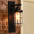 1 Bulb Cylinder Wall Mounted Light Fixture Industrial Black Clear Glass Lighting with Cage Black Clearhalo 'Art deco wall lights' 'Cast Iron' 'Glass' 'Industrial wall lights' 'Industrial' 'Middle century wall lights' 'Modern' 'Rustic wall lights' 'Tiffany' 'Traditional wall lights' 'Wall Lamps & Sconces' 'Wall Lights' Lighting' 612679