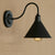 Cone Bedroom Wall Lighting with Gooseneck Arm Farmhouse Metal 1 Light Black/White Wall Sconce Lamp Black Clearhalo 'Art deco wall lights' 'Cast Iron' 'Glass' 'Industrial wall lights' 'Industrial' 'Middle century wall lights' 'Modern' 'Rustic wall lights' 'Tiffany' 'Traditional wall lights' 'Wall Lamps & Sconces' 'Wall Lights' Lighting' 616424
