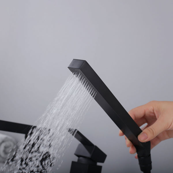 Modern Deck Mounted Metal Freestanding Tub Filler Low Arc Freestanding Faucet in Black Clearhalo 'Bathroom Remodel & Bathroom Fixtures' 'Bathtub Faucets' 'bathtub_faucets' 'Home Improvement' 'home_improvement' 'home_improvement_bathtub_faucets' 6628647