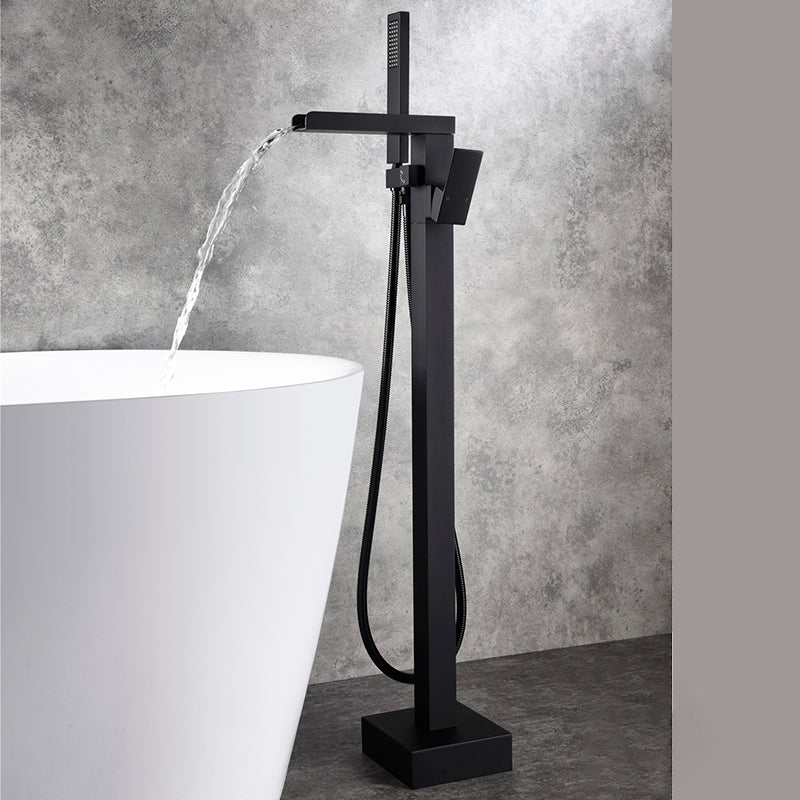Modern Floor Mounted Copper Freestanding Tub Filler Freestanding Low Arc Tub Filler Trim Black Waterfall Comes Out Ground Clearhalo 'Bathroom Remodel & Bathroom Fixtures' 'Bathtub Faucets' 'bathtub_faucets' 'Home Improvement' 'home_improvement' 'home_improvement_bathtub_faucets' 6714549