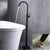 Modern Floor Mounted High Arc Freestanding Tub Filler Metal Freestanding Tub Filler Trim Black Round Ground Clearhalo 'Bathroom Remodel & Bathroom Fixtures' 'Bathtub Faucets' 'bathtub_faucets' 'Home Improvement' 'home_improvement' 'home_improvement_bathtub_faucets' 6714655
