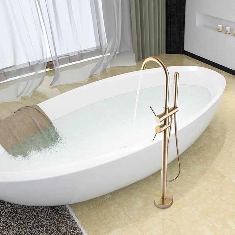 Traditional Floor Mounted Metal Freestanding Tub Filler High Arc Freestanding Faucet Light Gold 2 Handle Faucets Hand Shower Included Clearhalo 'Bathroom Remodel & Bathroom Fixtures' 'Bathtub Faucets' 'bathtub_faucets' 'Home Improvement' 'home_improvement' 'home_improvement_bathtub_faucets' 6714690