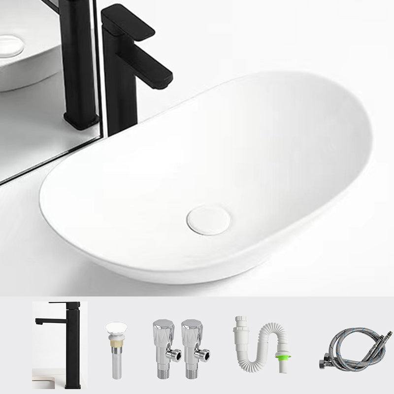 Luxury Bathroom Sink Ceramic Oval White Basin Drain Assembly Bathroom Sink 24"L x 14.2"W x 6.3"H Black Square Faucet Clearhalo 'Bathroom Remodel & Bathroom Fixtures' 'Bathroom Sinks & Faucet Components' 'Bathroom Sinks' 'bathroom_sink' 'Home Improvement' 'home_improvement' 'home_improvement_bathroom_sink' 6743447