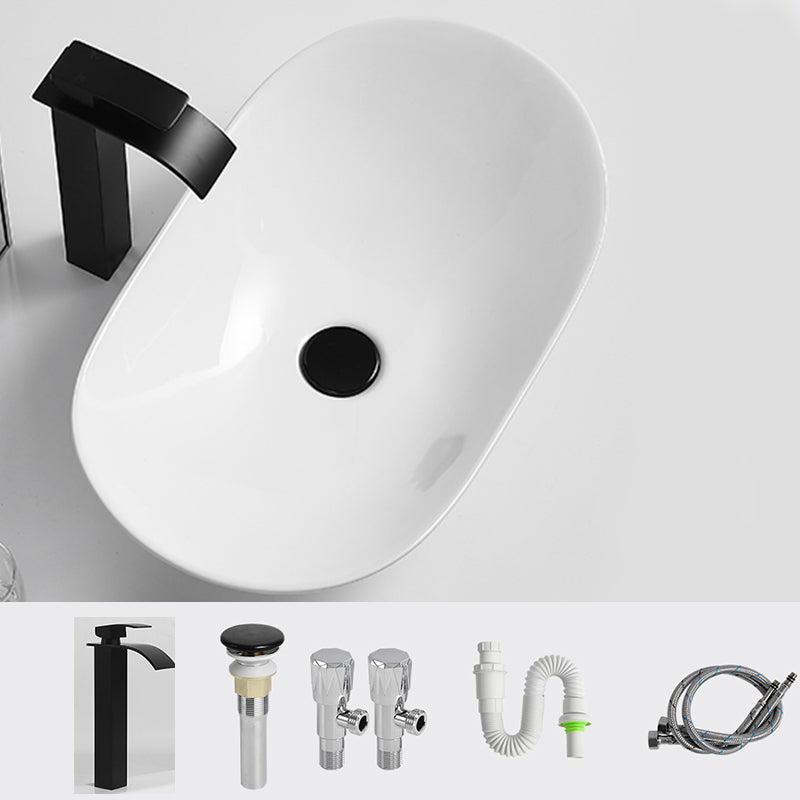 Luxury Bathroom Sink Ceramic Oval White Basin Drain Assembly Bathroom Sink 24"L x 14.2"W x 6.3"H Black Waterfall Comes Out Clearhalo 'Bathroom Remodel & Bathroom Fixtures' 'Bathroom Sinks & Faucet Components' 'Bathroom Sinks' 'bathroom_sink' 'Home Improvement' 'home_improvement' 'home_improvement_bathroom_sink' 6743450