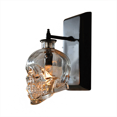 Clear Glass Skull Shaped Wall Sconce Modern 1 Light Living Room Lighting Fixture in Black Black Clearhalo 'Art deco wall lights' 'Cast Iron' 'Glass' 'Industrial wall lights' 'Industrial' 'Middle century wall lights' 'Modern' 'Rustic wall lights' 'Tiffany' 'Traditional wall lights' 'Wall Lamps & Sconces' 'Wall Lights' Lighting' 6767868