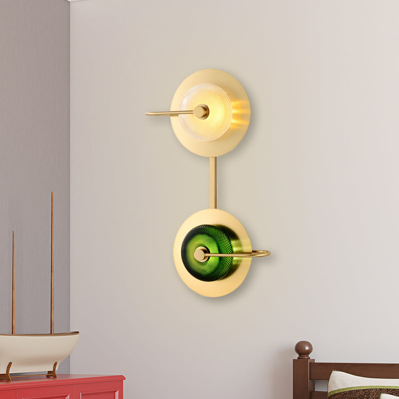 Doughnut Bedside Sconce Light Clear and Green Lattice Glass LED Modernist Wall Lamp in Brass with 2-Disk Detail Clearhalo 'Cast Iron' 'Glass' 'Industrial' 'Modern wall lights' 'Modern' 'Tiffany' 'Traditional wall lights' 'Wall Lamps & Sconces' 'Wall Lights' Lighting' 679000