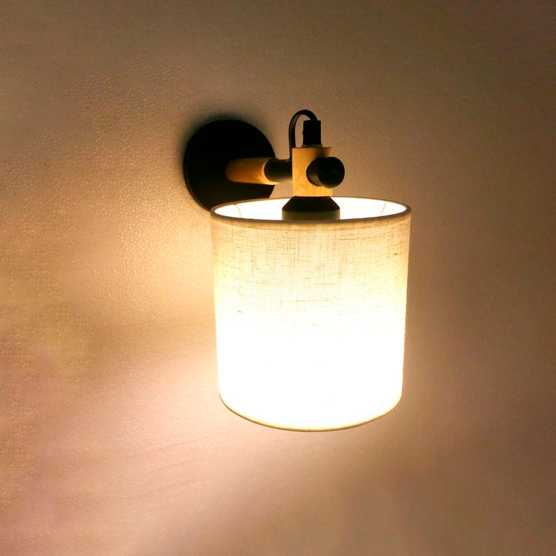 Fabric Cylindrical Sconce Wall Light Modernist 1 Light Bedroom Wall Mount Fixture with Wooden Joint in Black/White Clearhalo 'Industrial wall lights' 'Industrial' 'Middle century wall lights' 'Rustic wall lights' 'Tiffany' 'Wall Lamps & Sconces' 'Wall Lights' Lighting' 679402