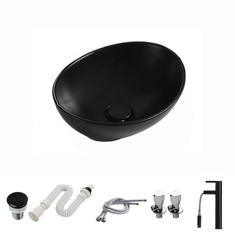 Modern Vessel Bathroom Sink Porcelain Oval with Pop-Up Drain and Faucet Vessel Sink 16"L x 13"W x 6"H Black Pulling Clearhalo 'Bathroom Remodel & Bathroom Fixtures' 'Bathroom Sinks & Faucet Components' 'Bathroom Sinks' 'bathroom_sink' 'Home Improvement' 'home_improvement' 'home_improvement_bathroom_sink' 6818760