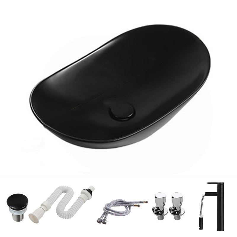 Modern Vessel Bathroom Sink Porcelain Oval with Pop-Up Drain and Faucet Vessel Sink 23.6"L x 14.2"W x 5.9"H Black Pulling Clearhalo 'Bathroom Remodel & Bathroom Fixtures' 'Bathroom Sinks & Faucet Components' 'Bathroom Sinks' 'bathroom_sink' 'Home Improvement' 'home_improvement' 'home_improvement_bathroom_sink' 6818762