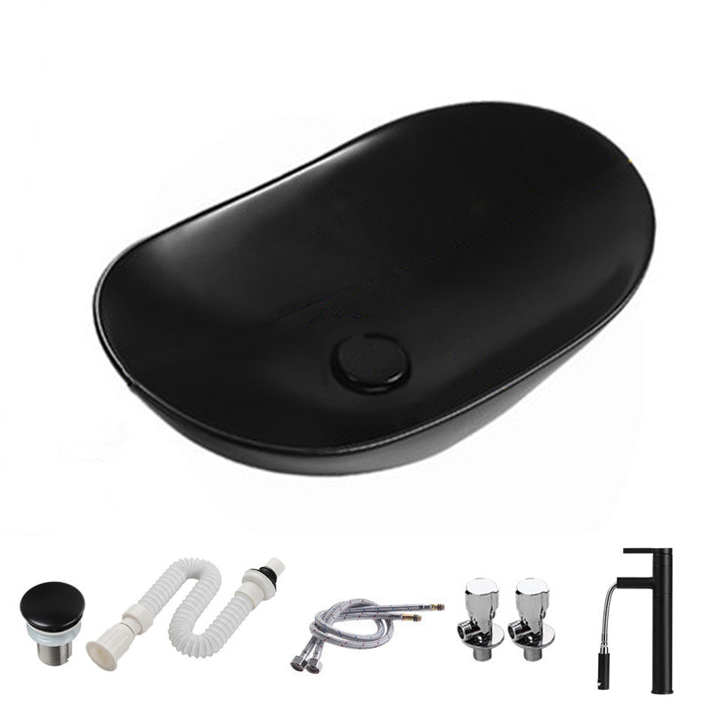 Modern Vessel Bathroom Sink Porcelain Oval with Pop-Up Drain and Faucet Vessel Sink 20.5"L x 12.8"W x 5.9"H Black Pulling Clearhalo 'Bathroom Remodel & Bathroom Fixtures' 'Bathroom Sinks & Faucet Components' 'Bathroom Sinks' 'bathroom_sink' 'Home Improvement' 'home_improvement' 'home_improvement_bathroom_sink' 6818763
