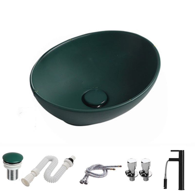 Modern Vessel Bathroom Sink Porcelain Oval with Pop-Up Drain and Faucet Vessel Sink 16"L x 13"W x 6"H Blackish Green Pulling Clearhalo 'Bathroom Remodel & Bathroom Fixtures' 'Bathroom Sinks & Faucet Components' 'Bathroom Sinks' 'bathroom_sink' 'Home Improvement' 'home_improvement' 'home_improvement_bathroom_sink' 6818769