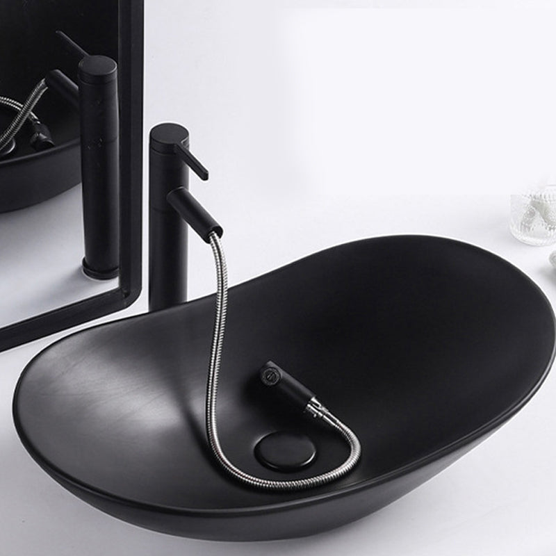 Modern Vessel Lavatory Sink Oval Porcelain with Faucet Vessel Sink 24"L x 14.2"W x 6.3"H Black Pulling Clearhalo 'Bathroom Remodel & Bathroom Fixtures' 'Bathroom Sinks & Faucet Components' 'Bathroom Sinks' 'bathroom_sink' 'Home Improvement' 'home_improvement' 'home_improvement_bathroom_sink' 6926791