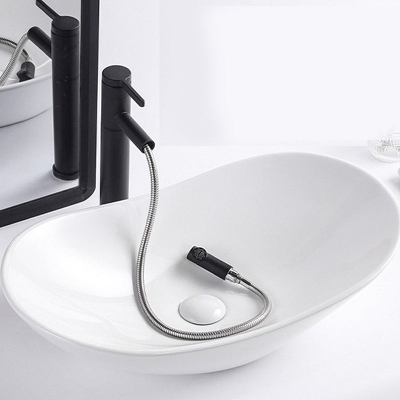 Modern Vessel Lavatory Sink Oval Porcelain with Faucet Vessel Sink 24"L x 14.2"W x 6.3"H White Pulling Clearhalo 'Bathroom Remodel & Bathroom Fixtures' 'Bathroom Sinks & Faucet Components' 'Bathroom Sinks' 'bathroom_sink' 'Home Improvement' 'home_improvement' 'home_improvement_bathroom_sink' 6926794