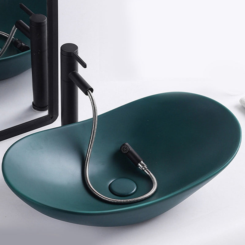 Modern Vessel Lavatory Sink Oval Porcelain with Faucet Vessel Sink 24"L x 14.2"W x 6.3"H Green Pulling Clearhalo 'Bathroom Remodel & Bathroom Fixtures' 'Bathroom Sinks & Faucet Components' 'Bathroom Sinks' 'bathroom_sink' 'Home Improvement' 'home_improvement' 'home_improvement_bathroom_sink' 6926795