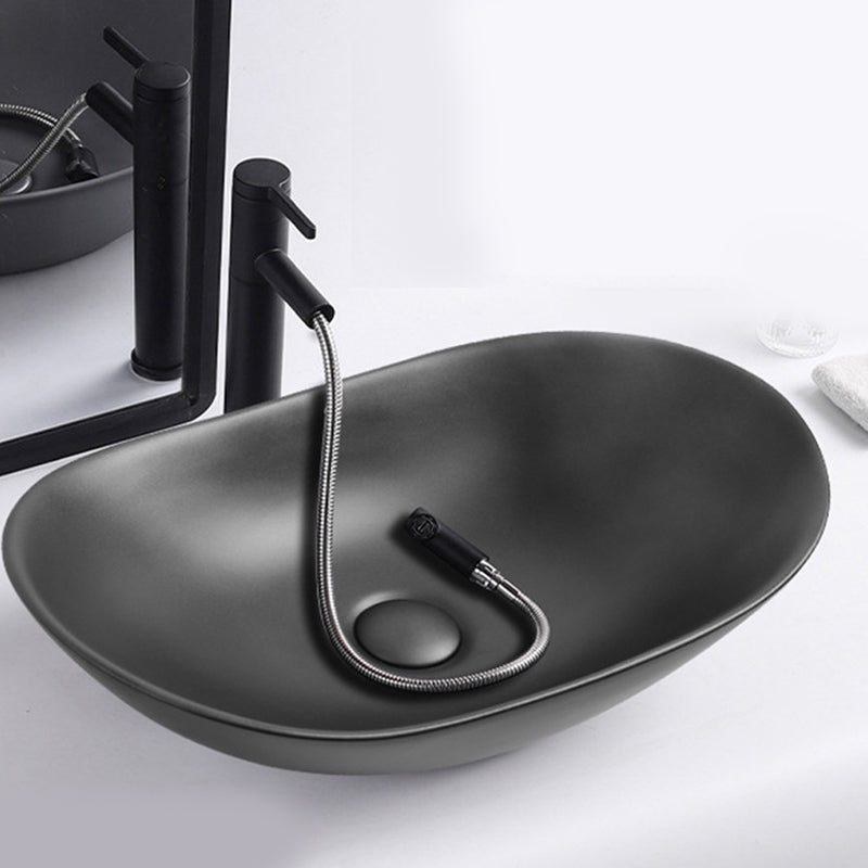 Modern Vessel Lavatory Sink Oval Porcelain with Faucet Vessel Sink 24"L x 14.2"W x 6.3"H Gun Grey Pulling Clearhalo 'Bathroom Remodel & Bathroom Fixtures' 'Bathroom Sinks & Faucet Components' 'Bathroom Sinks' 'bathroom_sink' 'Home Improvement' 'home_improvement' 'home_improvement_bathroom_sink' 6926797