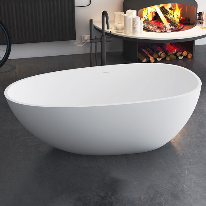 Modern Stone Oval Bath Freestanding Soaking Bathtub in White 67"L x 35"W x 22"H Thick (0.75"-1.25") Clearhalo 'Bathroom Remodel & Bathroom Fixtures' 'Bathtubs' 'Home Improvement' 'home_improvement' 'home_improvement_bathtubs' 'Showers & Bathtubs' 7003588