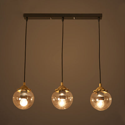 Orb Clear Glass Multi-Light Pendant Modern 3-Light Coffee Shop Hanging Lamp in Black with Linear/Round Canopy Black Linear Clearhalo 'Ceiling Lights' 'Glass shade' 'Glass' 'Industrial Pendants' 'Industrial' 'Middle Century Pendants' 'Pendant Lights' 'Pendants' 'Tiffany' Lighting' 70092