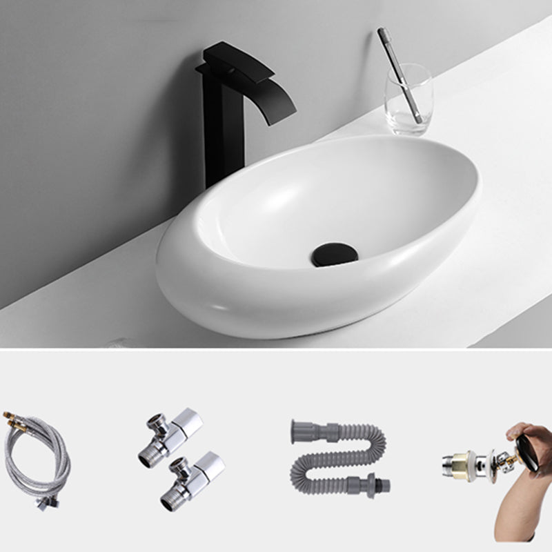 Contemporary Bathroom Sink with Pop-Up Drain Porcelain Oval-Shape Vessel Lavatory Sink 22.8"L x 14.6"W x 5.1"H Waterfall Faucet Sink with Faucet Clearhalo 'Bathroom Remodel & Bathroom Fixtures' 'Bathroom Sinks & Faucet Components' 'Bathroom Sinks' 'bathroom_sink' 'Home Improvement' 'home_improvement' 'home_improvement_bathroom_sink' 7208989