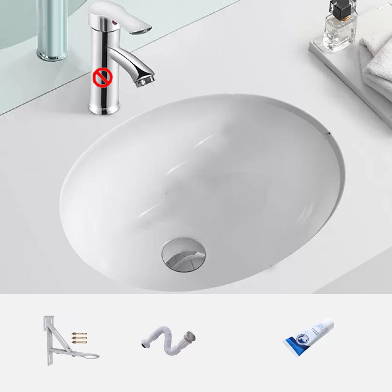Bathroom Sink Ceramic White Round Anti-spill Sink with Faucet 15"L x 11"W x 6"H Sink with Drainage Components Clearhalo 'Bathroom Remodel & Bathroom Fixtures' 'Bathroom Sinks & Faucet Components' 'Bathroom Sinks' 'bathroom_sink' 'Home Improvement' 'home_improvement' 'home_improvement_bathroom_sink' 7227363