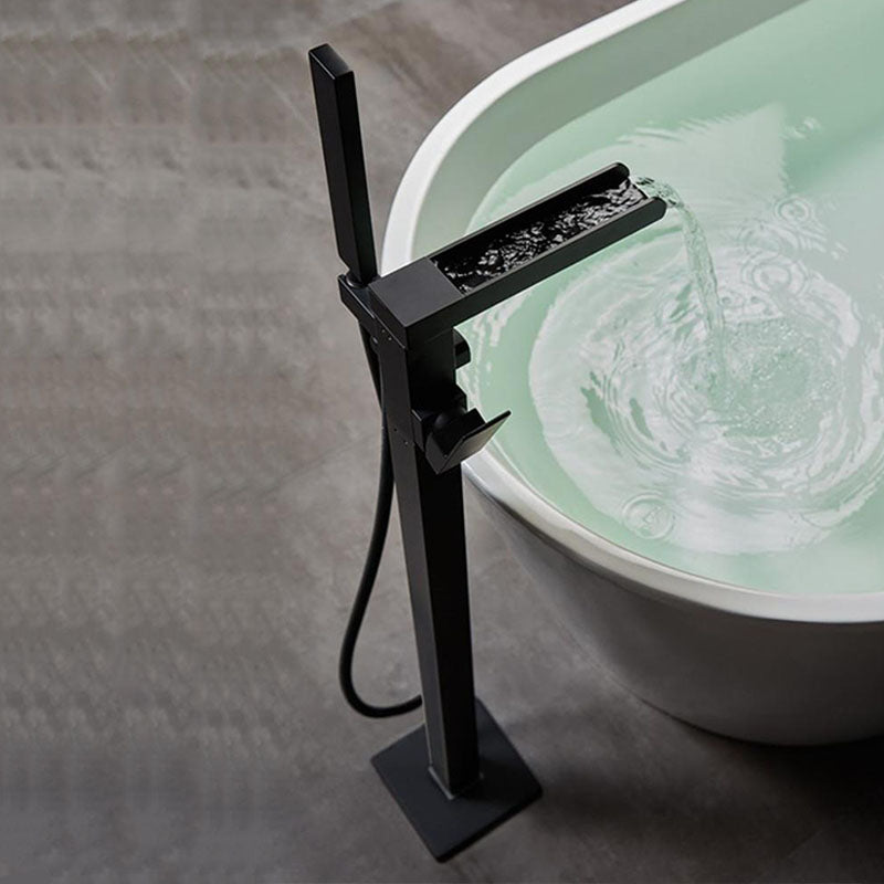 Brass Freestanding Tub Filler with Waterfall Spout Floor Mounted Bathroom Faucet Clearhalo 'Bathroom Remodel & Bathroom Fixtures' 'Bathtub Faucets' 'bathtub_faucets' 'Home Improvement' 'home_improvement' 'home_improvement_bathtub_faucets' 7227585