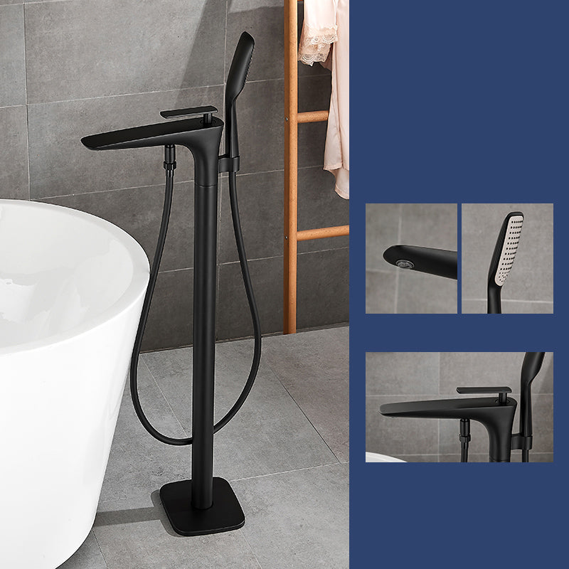 Floor Mount Bathroom Faucet Solid Color Low Arc Freestanding Tub Faucet Black Lever Handles Hand Shower Included Clearhalo 'Bathroom Remodel & Bathroom Fixtures' 'Bathtub Faucets' 'bathtub_faucets' 'Home Improvement' 'home_improvement' 'home_improvement_bathtub_faucets' 7241874