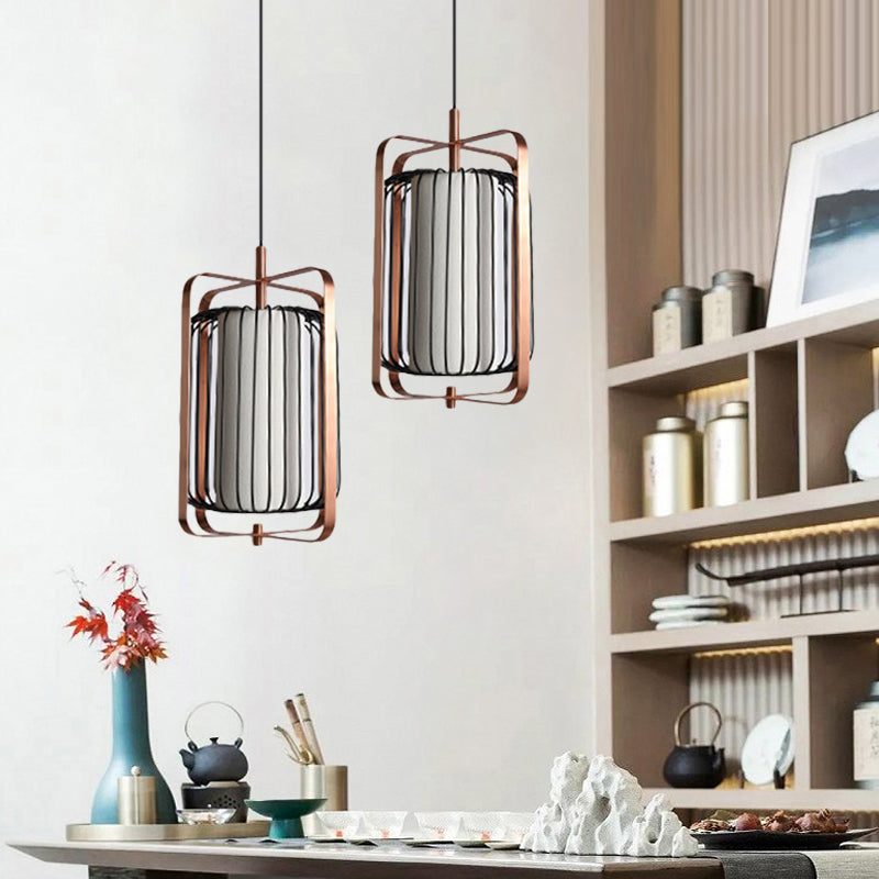 Rectangle Frame Pendant Modernism Metal 1 Light Rose Gold Suspension Lamp with Cylinder Black Cage and White Fabric Shade Clearhalo 'Ceiling Lights' 'Modern Pendants' 'Modern' 'Pendant Lights' 'Pendants' Lighting' 730052
