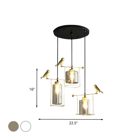 Cylinder Dining Room Cluster Pendant Cream/Smoke Gray Glass 3 Bulbs Modernism Suspension Lamp with Gold Bird Deco Clearhalo 'Ceiling Lights' 'Chandeliers' 'Glass shade' 'Glass' 'Modern Pendants' 'Modern' 'Pendant Lights' 'Pendants' Lighting' 731490