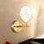 Gold Circle Panel Sconce Light Fixture Post Modern LED Acrylic Wall Lamp with Lotus Pattern in White/Warm Light Gold Clearhalo 'Cast Iron' 'Glass' 'Industrial' 'Modern wall lights' 'Modern' 'Tiffany' 'Traditional wall lights' 'Wall Lamps & Sconces' 'Wall Lights' Lighting' 732653
