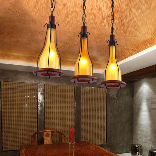 Brown Bottle Cluster Pendant Light Warehouse Yellow/White Glass 3 Heads Dining Room Ceiling Fixture with Wood Linear Canopy Yellow Clearhalo 'Art Deco Pendants' 'Cast Iron' 'Ceiling Lights' 'Ceramic' 'Crystal' 'Industrial Pendants' 'Industrial' 'Metal' 'Middle Century Pendants' 'Pendant Lights' 'Pendants' 'Tiffany' Lighting' 736176