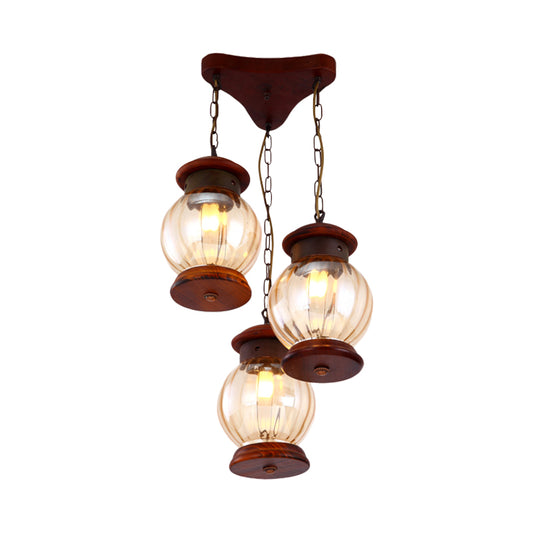 Factory Lantern Cluster Pendant 3-Bulb Tan Glass Suspension Lighting in Copper with Wood Triangle Canopy Clearhalo 'Ceiling Lights' 'Glass shade' 'Glass' 'Industrial Pendants' 'Industrial' 'Middle Century Pendants' 'Pendant Lights' 'Pendants' 'Tiffany' Lighting' 736193