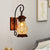 Copper Bottle Wall Sconce Light Industrial Tan Glass 1-Head Bedroom Wall Lamp with Curved Arm Copper Clearhalo 'Art deco wall lights' 'Cast Iron' 'Glass' 'Industrial wall lights' 'Industrial' 'Middle century wall lights' 'Modern' 'Rustic wall lights' 'Tiffany' 'Traditional wall lights' 'Wall Lamps & Sconces' 'Wall Lights' Lighting' 736319