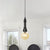 1 Light Ball/Capsule Suspension Light Industrial Black Finish Amber Glass Ceiling Pendant Pipe Lamp Black A Clearhalo 'Ceiling Lights' 'Glass shade' 'Glass' 'Industrial Pendants' 'Industrial' 'Middle Century Pendants' 'Pendant Lights' 'Pendants' 'Tiffany' Lighting' 737453