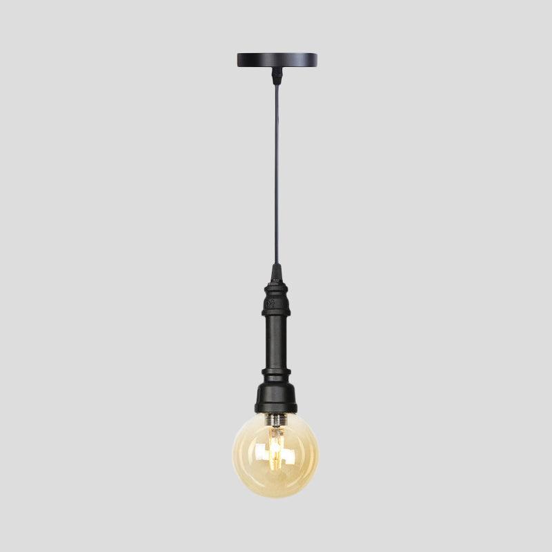 1 Light Ball/Capsule Suspension Light Industrial Black Finish Amber Glass Ceiling Pendant Pipe Lamp Clearhalo 'Ceiling Lights' 'Glass shade' 'Glass' 'Industrial Pendants' 'Industrial' 'Middle Century Pendants' 'Pendant Lights' 'Pendants' 'Tiffany' Lighting' 737455