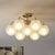 7-Head Bedroom Semi Flush Postmodern Brass Finish Radial Close to Ceiling Lamp with Ball Foggy Glass Shade Brass Clearhalo 'Ceiling Lights' 'Close To Ceiling Lights' 'Close to ceiling' 'Glass shade' 'Glass' 'Semi-flushmount' Lighting' 757160