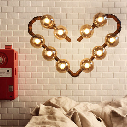 Heart Shape Pipe Metal Wall Sconce Industrial 10 Bulbs Restaurant Wall Mounted Lamp in Rust with Ball Clear Glass Shade Rust Clearhalo 'Art deco wall lights' 'Cast Iron' 'Glass' 'Industrial wall lights' 'Industrial' 'Middle century wall lights' 'Modern' 'Rustic wall lights' 'Tiffany' 'Traditional wall lights' 'Wall Lamps & Sconces' 'Wall Lights' Lighting' 758671