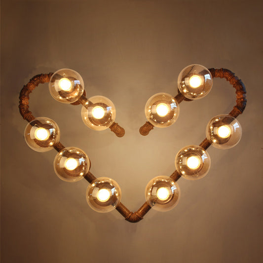 Heart Shape Pipe Metal Wall Sconce Industrial 10 Bulbs Restaurant Wall Mounted Lamp in Rust with Ball Clear Glass Shade Clearhalo 'Art deco wall lights' 'Cast Iron' 'Glass' 'Industrial wall lights' 'Industrial' 'Middle century wall lights' 'Modern' 'Rustic wall lights' 'Tiffany' 'Traditional wall lights' 'Wall Lamps & Sconces' 'Wall Lights' Lighting' 758673