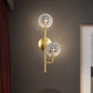 Sphere Bathroom Wall Mount Light Amber/Smoke Gray Glass 2-Head Brass Finish LED Wall Sconce Smoke Gray Clearhalo 'Cast Iron' 'Glass' 'Industrial' 'Modern wall lights' 'Modern' 'Tiffany' 'Traditional wall lights' 'Wall Lamps & Sconces' 'Wall Lights' Lighting' 758934