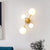 Modernism 4-Light Sconce Lighting with Cream Glass Shade Black/Gold Finish Orb Wall Mounted Lamp Fixture Gold Clearhalo 'Cast Iron' 'Glass' 'Industrial' 'Modern wall lights' 'Modern' 'Tiffany' 'Traditional wall lights' 'Wall Lamps & Sconces' 'Wall Lights' Lighting' 759025