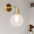 Spherical Wall Sconce Light 1 Light Clear Glass Shade Industrial Wall Lamp Light for Porch Clear 1.0 Clearhalo 'Cast Iron' 'Glass' 'Industrial wall lights' 'Industrial' 'Middle century wall lights' 'Modern' 'Tiffany' 'Traditional wall lights' 'Wall Lamps & Sconces' 'Wall Lights' Lighting' 769607