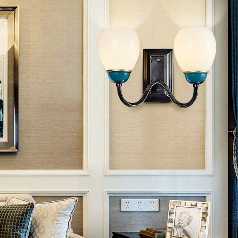 1/2-Head Globe Wall Lighting Fixture Countryside Black and Blue Opal Glass Wall Light Sconce with Curved Arm Clearhalo 'Wall Lamps & Sconces' 'Wall Lights' Lighting' 781105